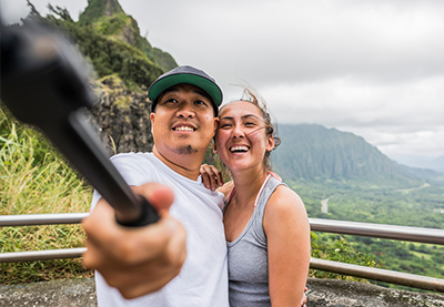 couple taking a picture with a selfie stick