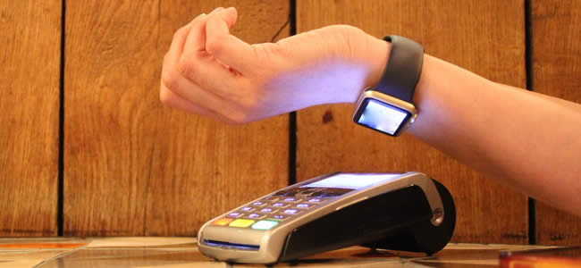 man paying with smart watch